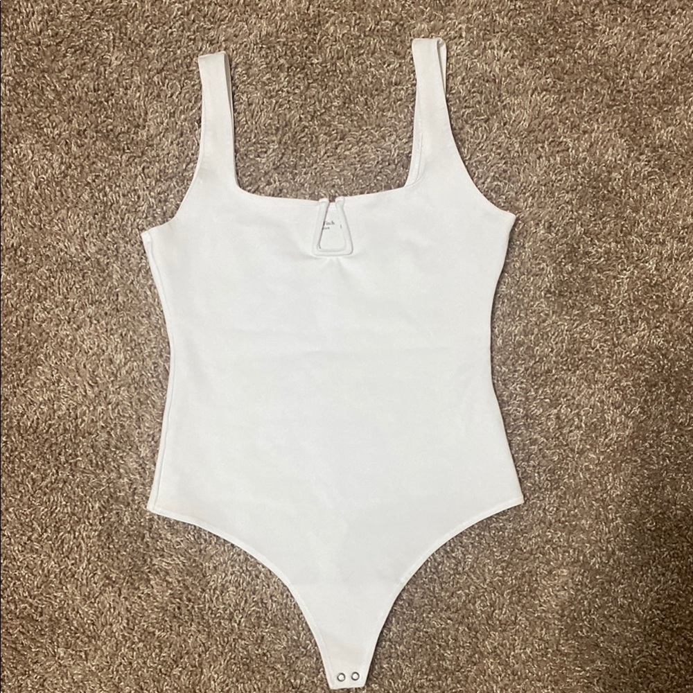 White One-Piece Bodysuit with Snap Closure